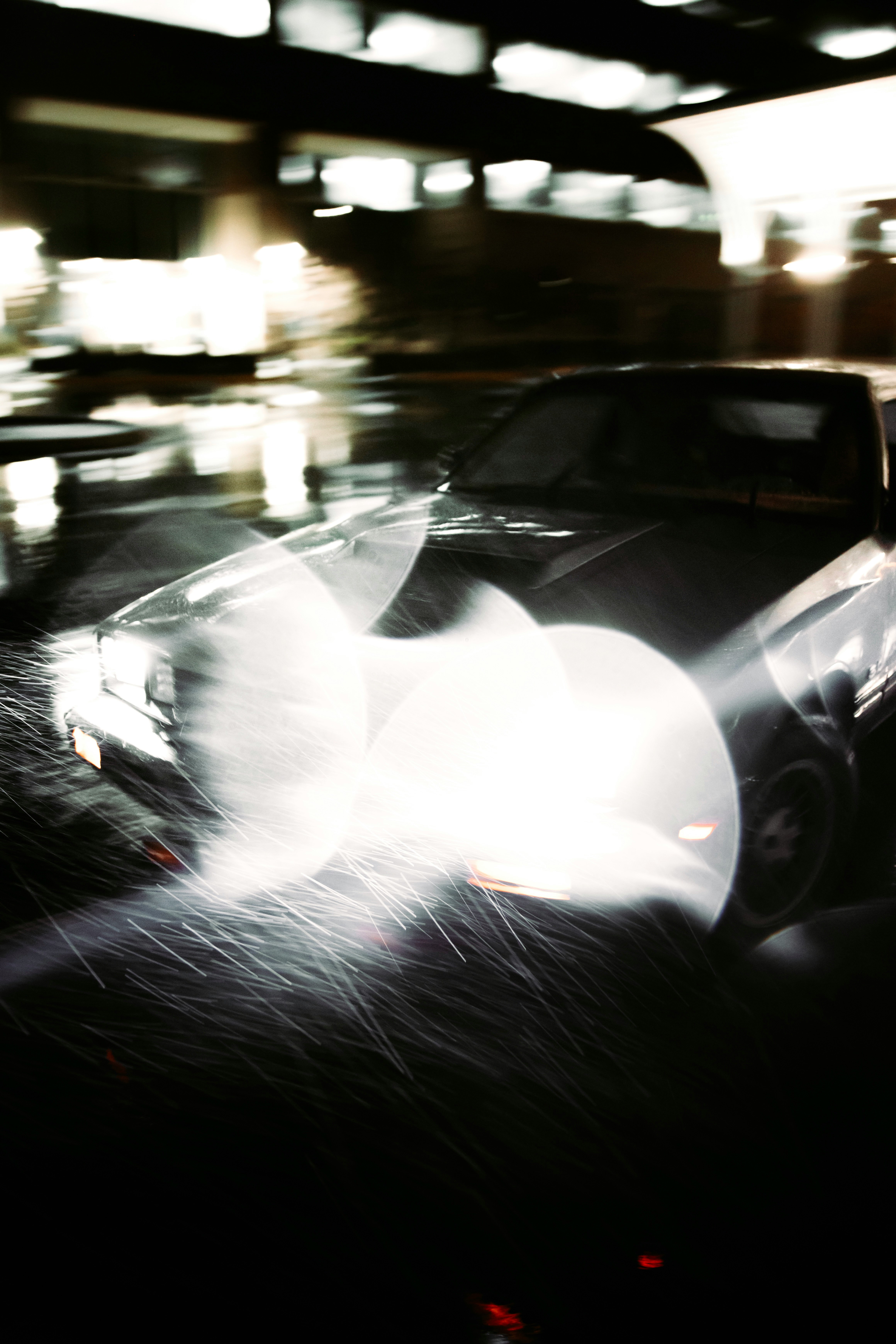 white car on road during night time